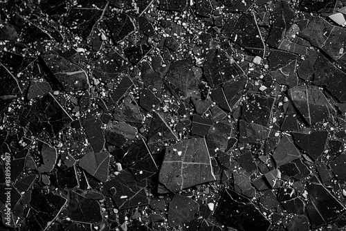 real black terrazzo marble pattern tile for interior flooring material. grey terrazzo chips on black background. matt rock flooring surface. generative ai