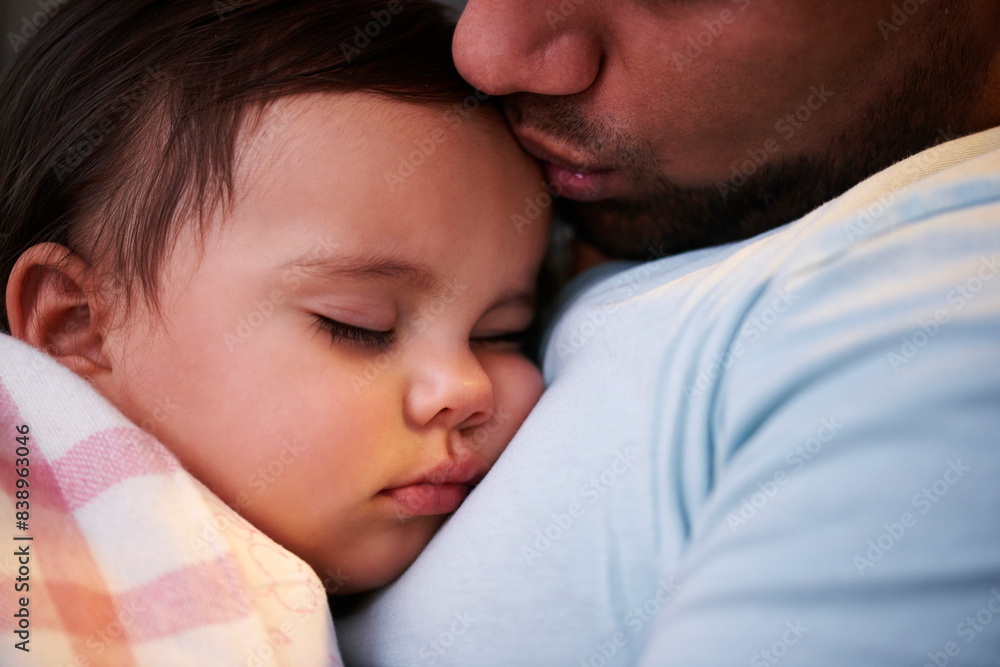 Close-up of father kissing sleeping baby girl Close-up of father kissing sleeping baby girl