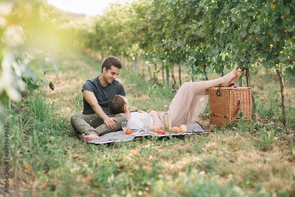 Young couple in love having picnic in the vineyards Young couple in love having picnic in the vineyards