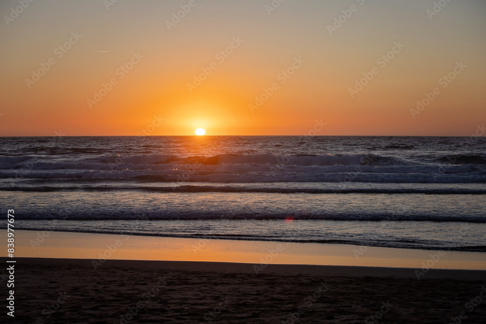 Happy children, boys, playing on the beach on sunset, kid cover in sand, smiling, laughing Happy children, boys, playing on the beach on sunset, kid cover in sand, smiling, laughing