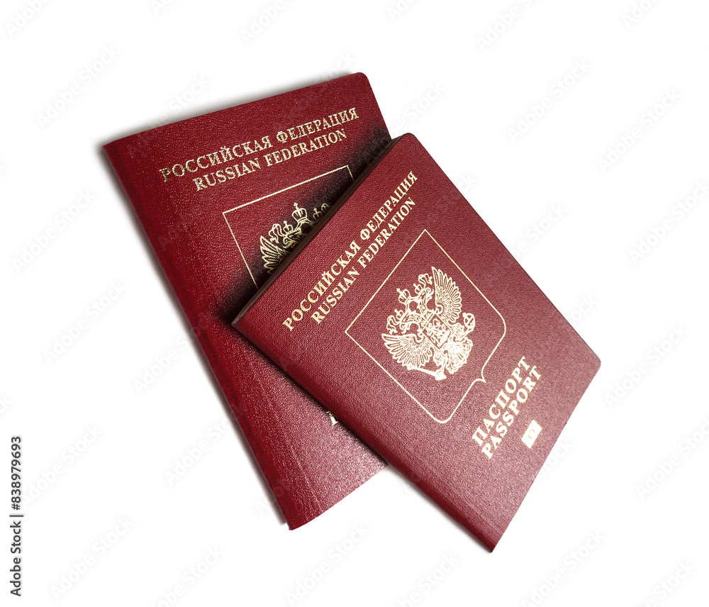 Two red russian foreign passports over white background studio shot close-up view Two red russian foreign passports over white background studio shot close-up view