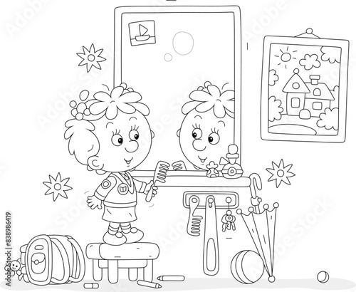 Funny little girl combing her hair in front of a mirror in a hallway with a picture on a wall, black and white vector cartoon illustration for a coloring book