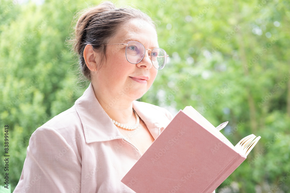 elegant Mature businesswoman, woman in pink jacket keeps records observations in diary, balance between professional goals and personal well-being elegant Mature businesswoman, woman in pink jacket keeps records observations in diary, balance between professional goals and personal well-being
