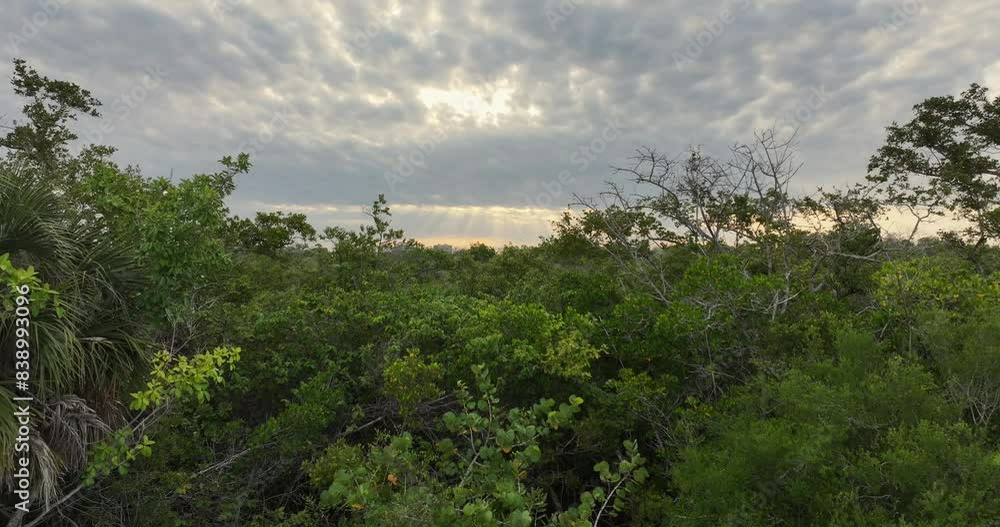 Sun beaming through clouds near Bonita Springs in Florida Sun beaming through clouds near Bonita Springs in Florida