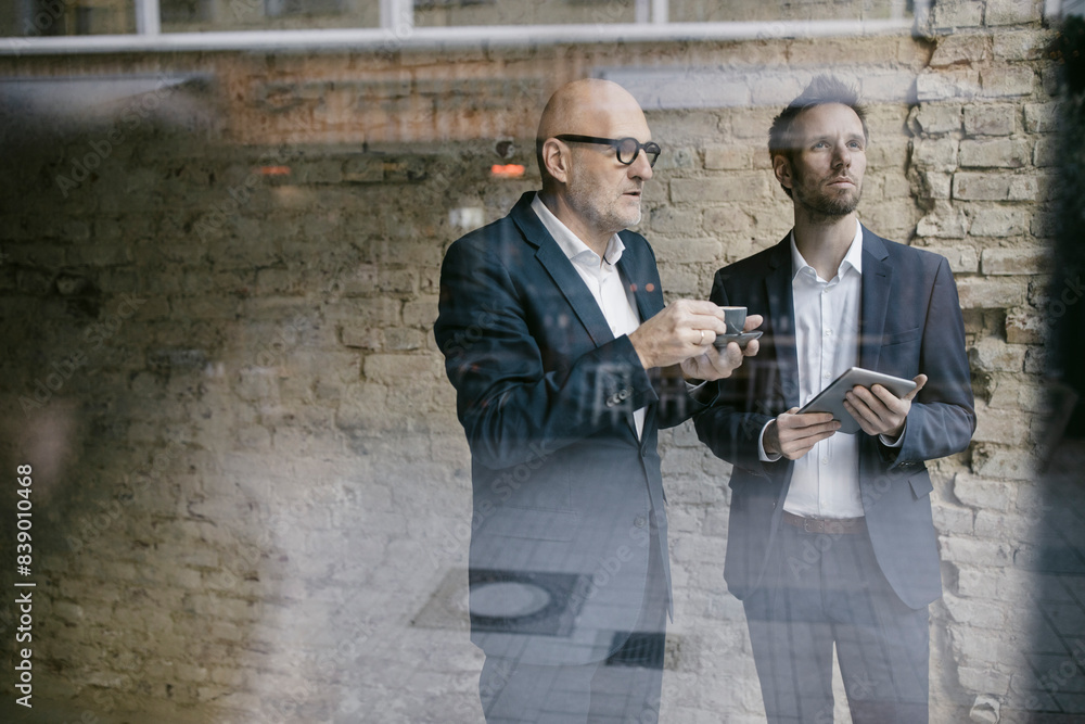 Senior and mid-adult businessman having a meeting