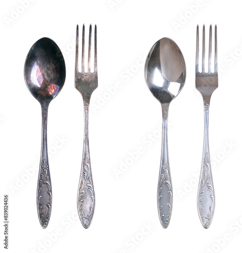 Φωτογραφία Sterling silver spoon and fork, tarnished and cleaned, isolated from above
