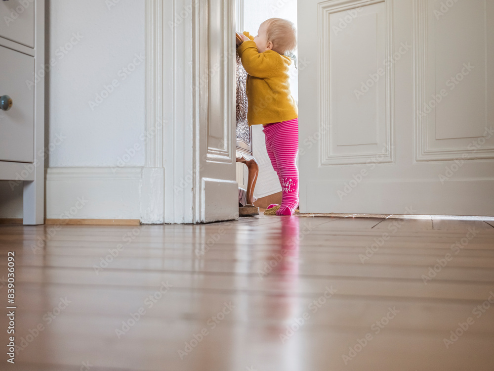 Curious baby girl exploring home Curious baby girl exploring home