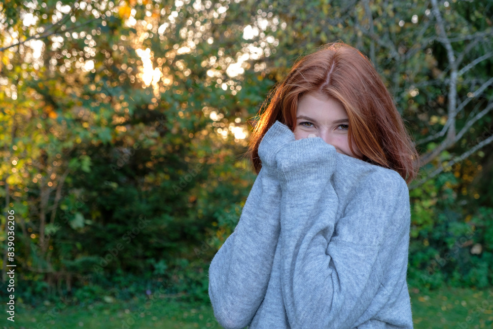 Portrait of teenage girl wearing grey pullover in autumn Portrait of teenage girl wearing grey pullover in autumn