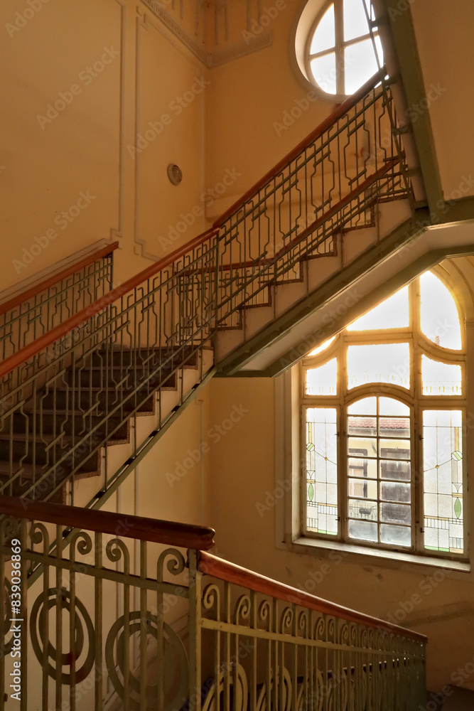 Stairwell, staircase inside the Menraths, Menrats Palace with elaborate handrails and stained glass windows, an example of Art Nouveau architecture in the city center, old town of Novi Sad, Serbia Stairwell, staircase inside the Menraths, Menrats Palace with elaborate handrails and stained glass windows, an example of Art Nouveau architecture in the city center, old town of Novi Sad, Serbia