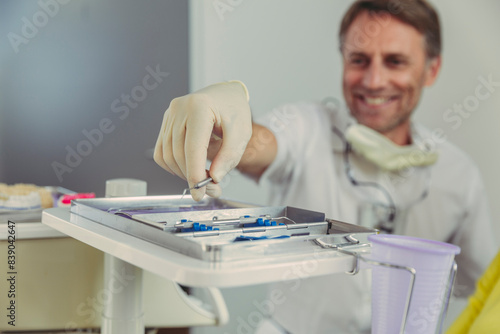 Dentist using dental instruments for treatment