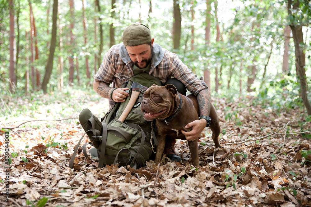Man with dog in forest Man with dog in forest