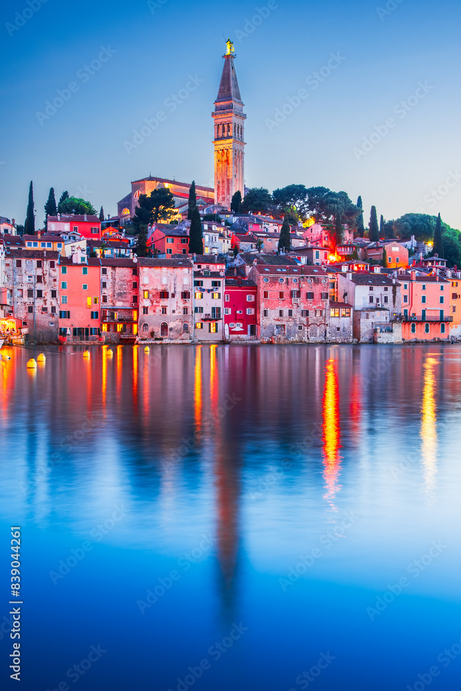 Obraz premium Rovinj - Istria Peninsula, Croatia. Twilight with old town harbor water reflection.