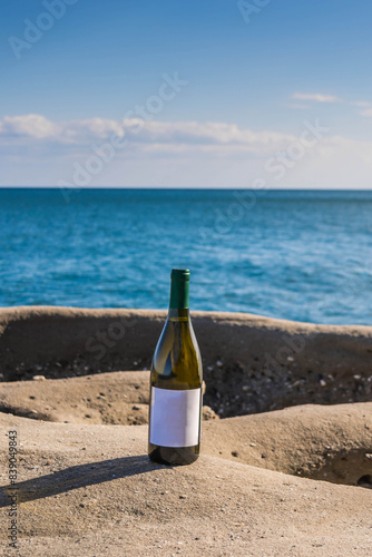 Bottle of wine by the sea