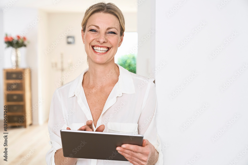 Portrait of happy woman using tablet at home Portrait of happy woman using tablet at home