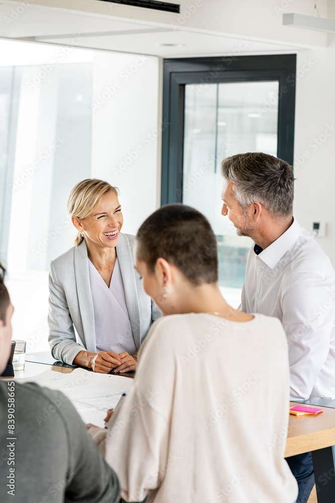 Senior businessman and woman leading workshop in office Senior businessman and woman leading workshop in office