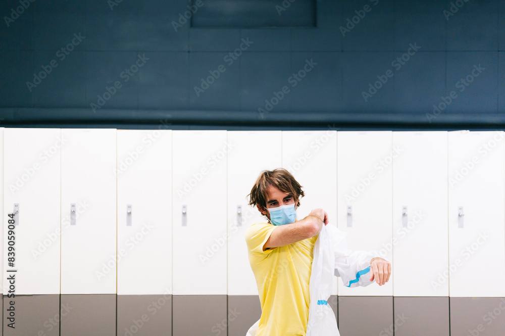 Healthcare worker wearing protective suit while working in hospital Healthcare worker wearing protective suit while working in hospital