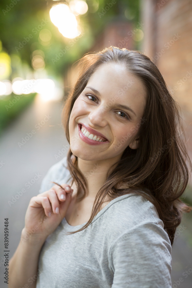 Portrait of smiling young woman outdoors Portrait of smiling young woman outdoors