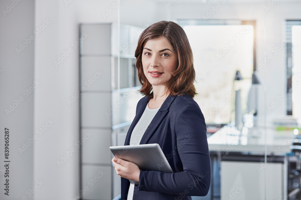Portrait of smiling young businesswoman with tablet in office Portrait of smiling young businesswoman with tablet in office