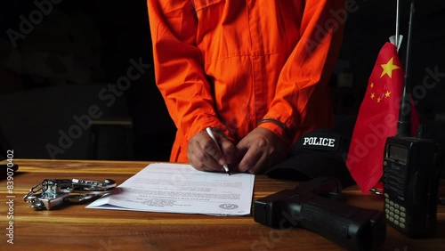 Detectives and prisoner in dark interrogation room