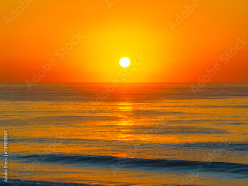 Aerial sunrise at the beach with clear skies