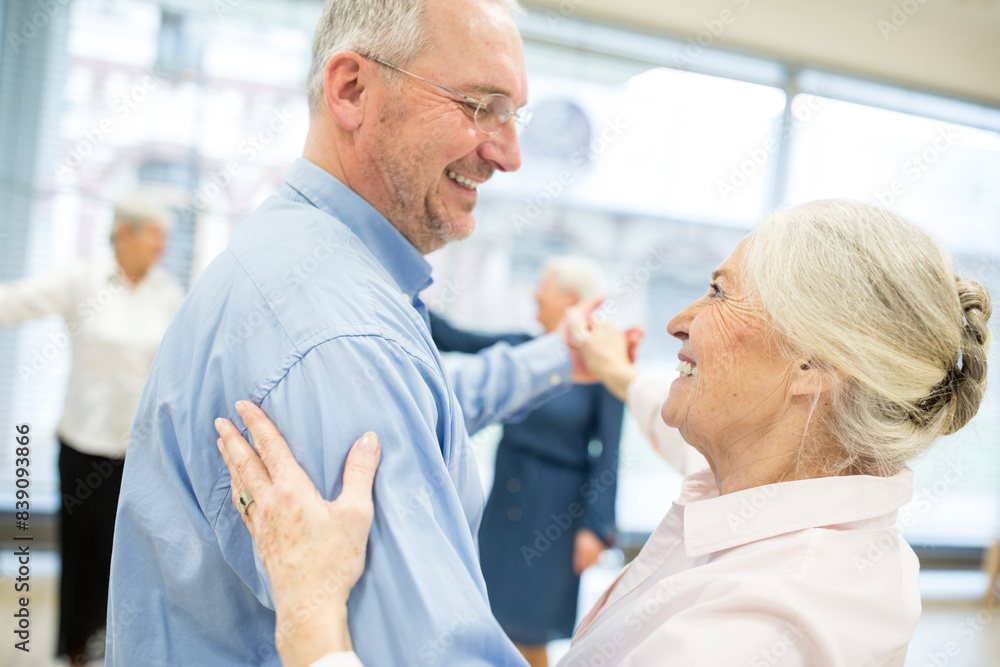 Group of active senior attending dance course in retirement home Group of active senior attending dance course in retirement home