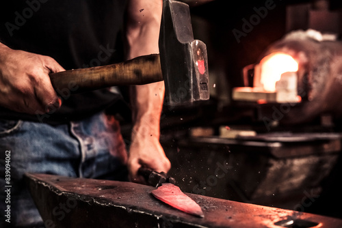 Tapeta Knife maker at work, steel splinter during hammering damask steel