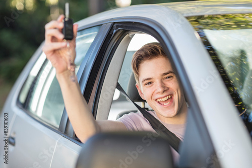 Happy learner driver cheering and holding car key © tunedin