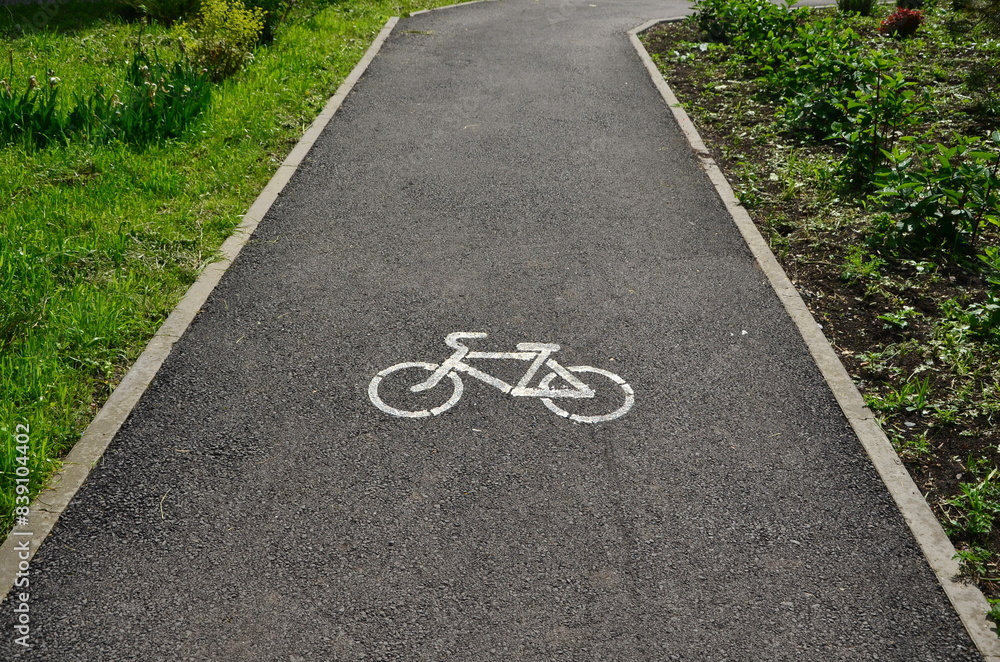 Obraz premium view of a bike path with a road sign