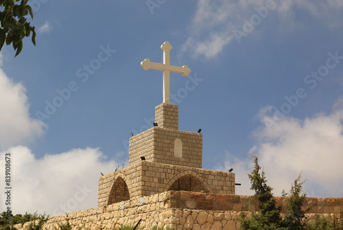 Stone Cross against Blue Sky photo