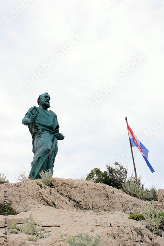 Statue of Sint Peter in the forestpark of Makarska, Croatia photo