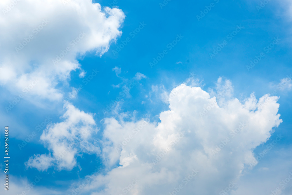 Tropical summer blue sky fluffy white cloud summertime on light sunny day cloudscape. Clear bright blue skyline spring sunlight climate background. Heaven blue environment ecology high scenic nature. Tropical summer blue sky fluffy white cloud summertime on light sunny day cloudscape. Clear bright blue skyline spring sunlight climate background. Heaven blue environment ecology high scenic nature.