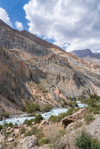 Scenic vertical landscape view of colorful Iskander darya river valley near Iskanderkul lake, Fann mountains, Sughd, Tajikistan