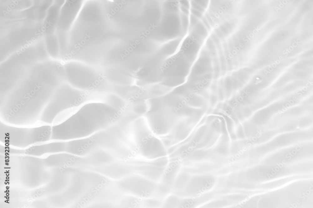 White water with ripples on the surface. Defocus blurred transparent white colored clear calm water surface texture with splashes and bubbles. Water waves with shining pattern texture background. White water with ripples on the surface. Defocus blurred transparent white colored clear calm water surface texture with splashes and bubbles. Water waves with shining pattern texture background.
