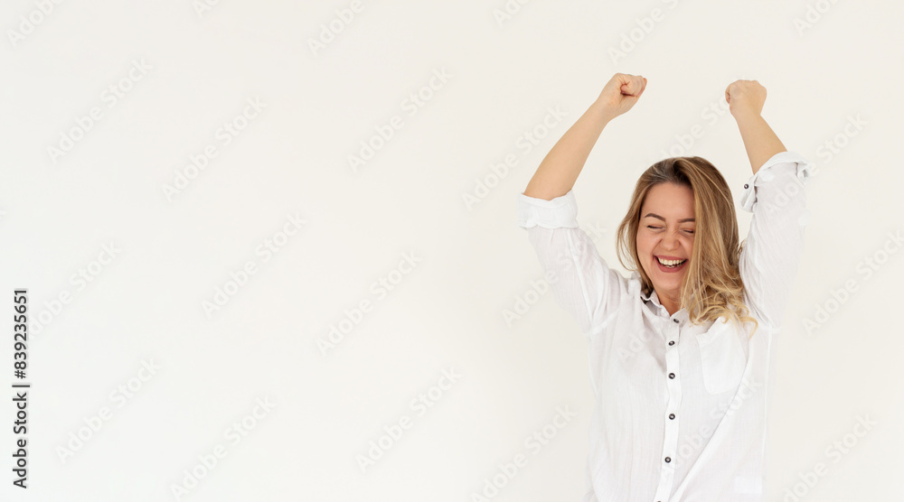 Excited young adult woman reacting to win, surprise news, screaming and cheering, triumphing, achieve goal and celebrating, standing over white background Excited young adult woman reacting to win, surprise news, screaming and cheering, triumphing, achieve goal and celebrating, standing over white background