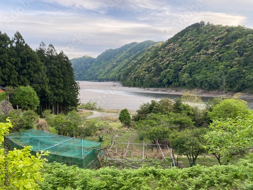 A beautiful view of the jungle and river surrounding the Kitayama River in the Wakayama prefecture of Japan.  Beautiful landscape. photo