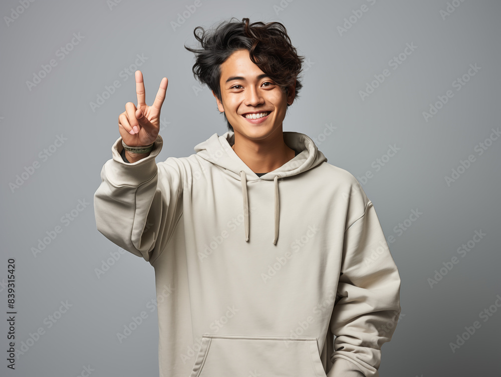 A joyful teanage in casual clothes against an isolated background A joyful teanage in casual clothes against an isolated background