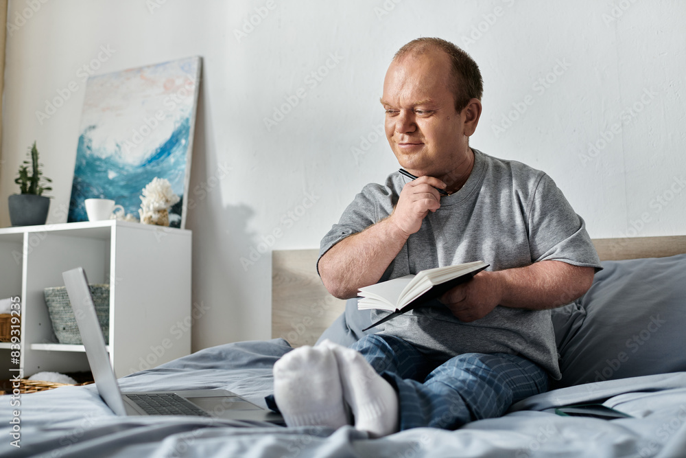 A man with inclusivity sits in bed, thoughtfully holding a notebook and pen, reflecting on his day. A man with inclusivity sits in bed, thoughtfully holding a notebook and pen, reflecting on his day.