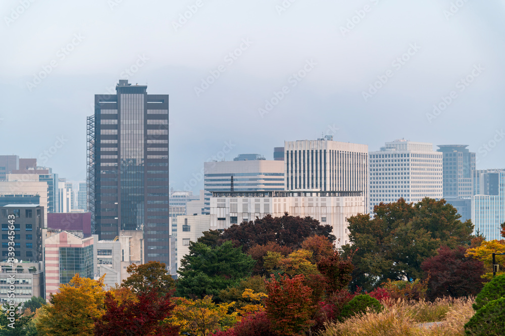 Fortress wall of Seoul city leading up to Namsan Baekbeom Plaza with autumn colorful park, Seoul, South Korea in autumn season Fortress wall of Seoul city leading up to Namsan Baekbeom Plaza with autumn colorful park, Seoul, South Korea in autumn season