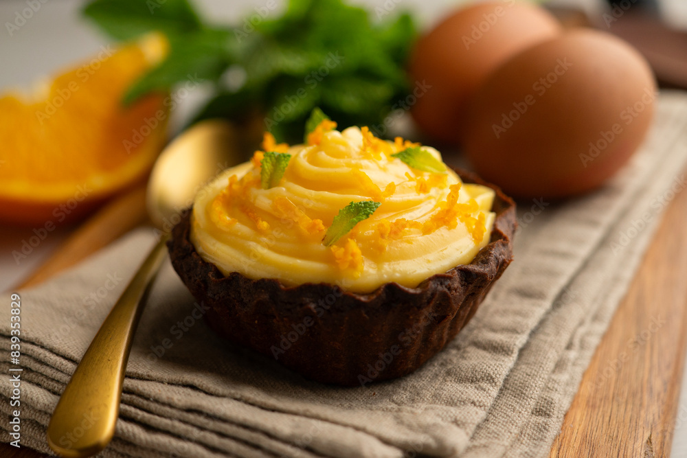 Chocolate tartlets with orange cream. Chocolate tartlets with orange cream.