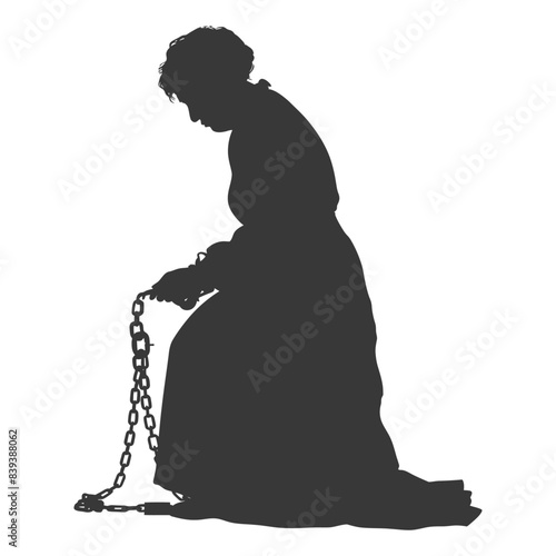 Silhouette of kneeling woman in dress with chain shackles, slavery theme.