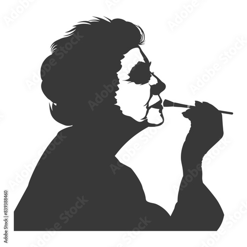 Elderly woman silhouette, applying makeup with brush, stark contrast.