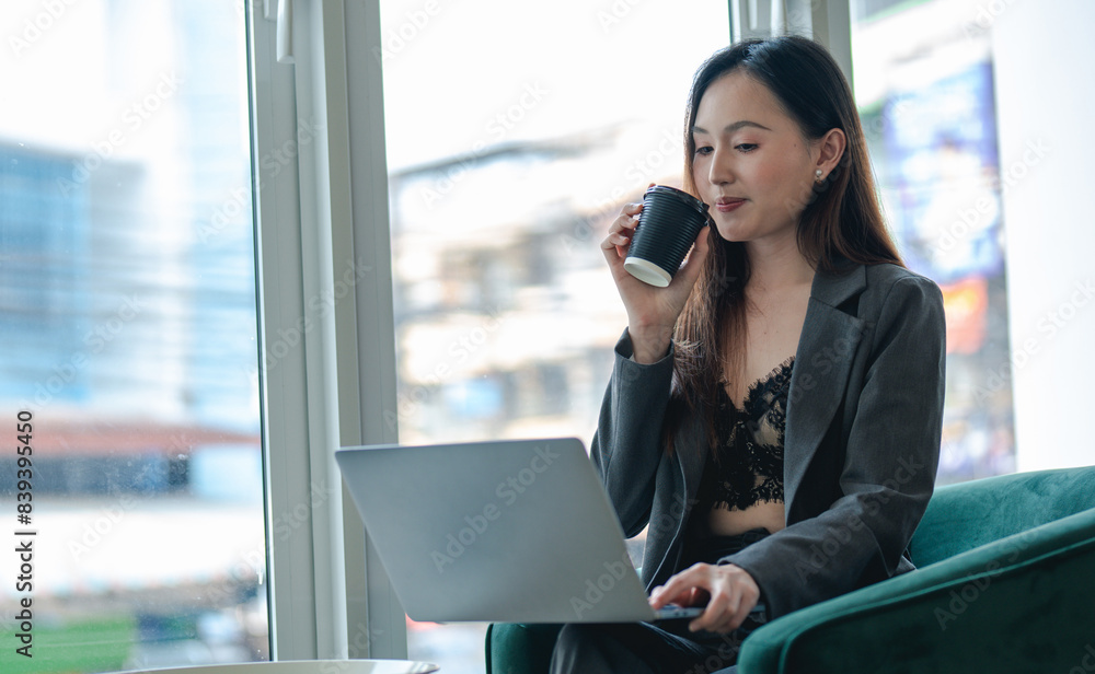 Smiling young asian businesswoman using computer at home office workplace, happy korean employee working on laptop, attractive japanese or chinese woman student studying communicating online with pc Smiling young asian businesswoman using computer at home office workplace, happy korean employee working on laptop, attractive japanese or chinese woman student studying communicating online with pc
