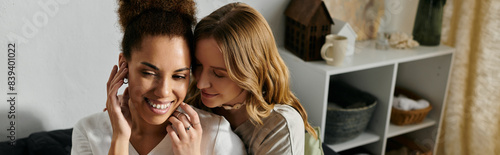 A lesbian couple shares a tender moment at home, their love and affection palpable.