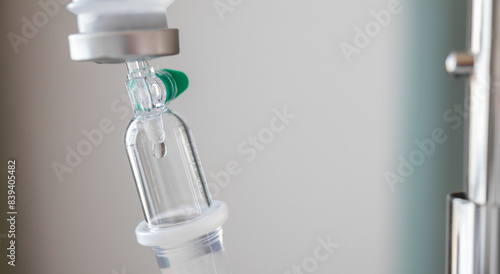 Close up medical intravenous IV drip in hospital background © Piman Khrutmuang