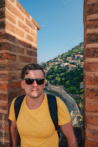 Man at fortress ruins of th...
