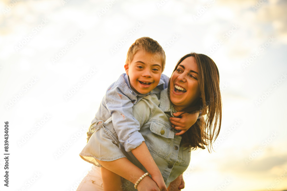 Nice mother and child Playing on great field at Sunset Nice mother and child Playing on great field at Sunset
