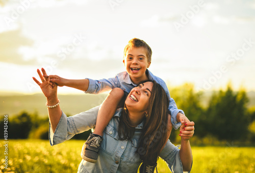 Nice mother and child Playing on great field at Sunset