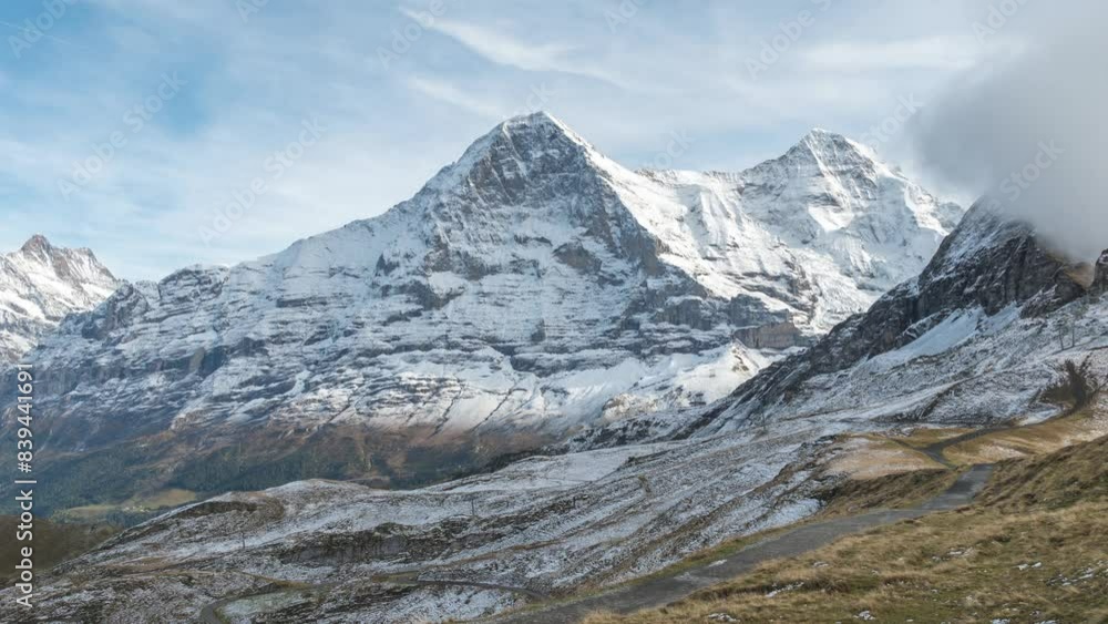 Mannlichen Switzerland time lapse, Alps mountain range with Jungfrau and Monch peak Mannlichen Switzerland time lapse, Alps mountain range with Jungfrau and Monch peak