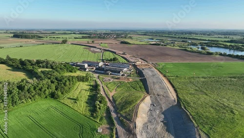 Highway destruction village in construction drone aerial Czech Prerov, agricultural land fields, remove of people houses and buildings land grabbing extension works additional lanes way new road photo