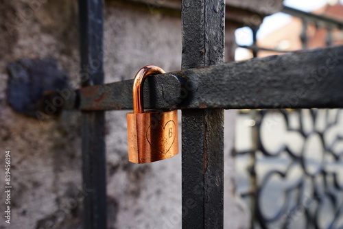 Fotografie Padlock left by lovers on a bridge